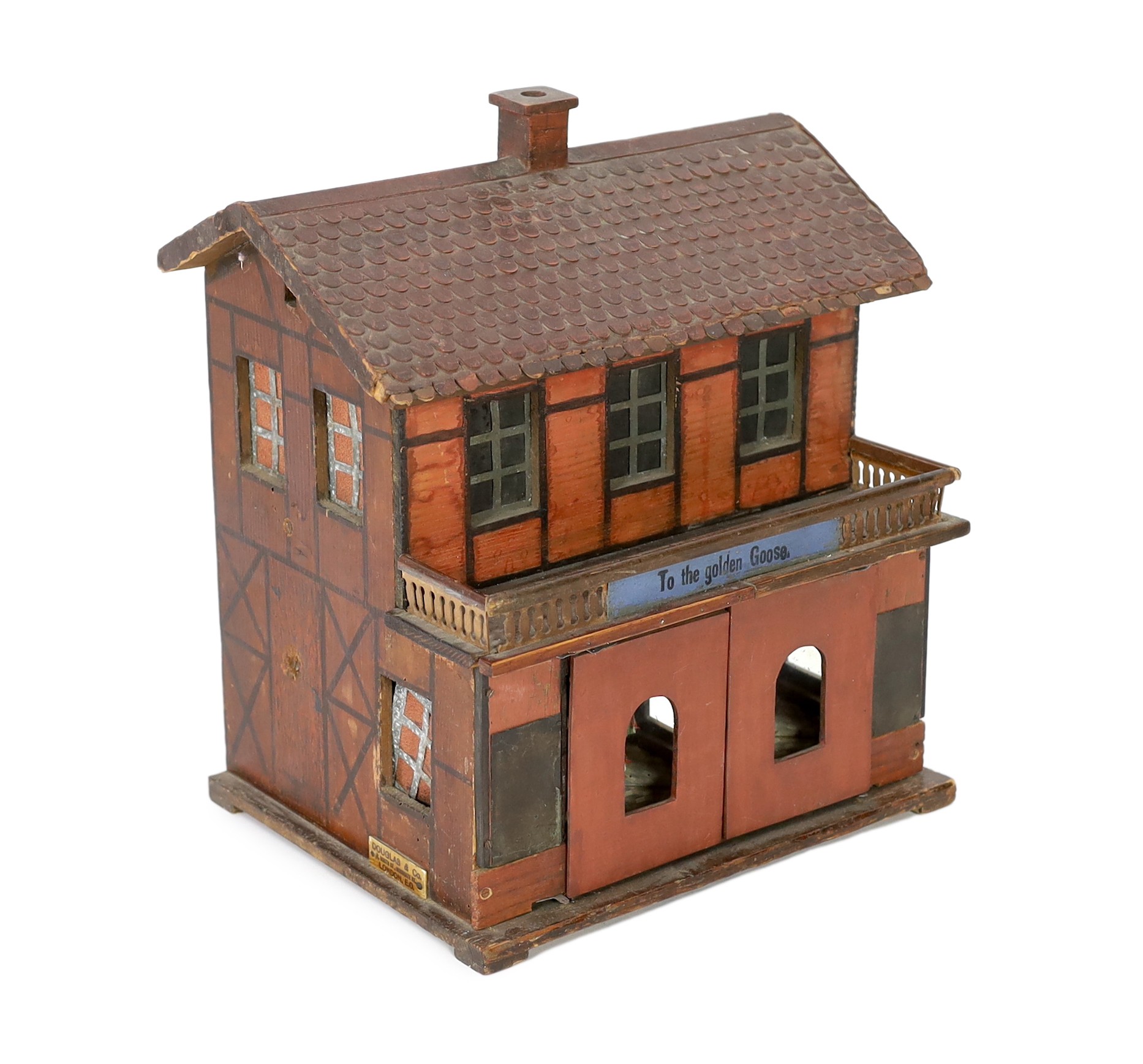 ‘To The Golden Goose’: A rare German musical toy modelled as two storey half-timbered building, circa 1890, 39cm high
